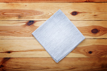 Kitchen. Wooden kitchen table with empty red tablecloth for dinner.