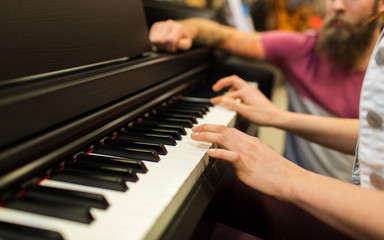 close up of woman hands playing piano