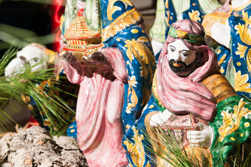 Fototapeta premium Painted pottery statue portraying one of the three wise men, work by a ceramic artisan in Caltagirone