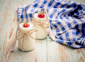 Yogurt glass, with strawberries and ceramic spoon