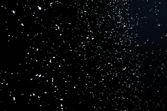 Snow on a black background for use as an overlay layer