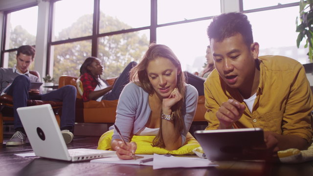  Cheerful young female student group working together with laptop computer