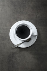 Cup of coffee on wooden  dark table