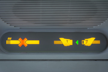 No Smoking and Fasten Seat belt Sign in the airplane