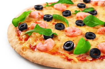 Pizza with shrimp olives and arugula on a white background.