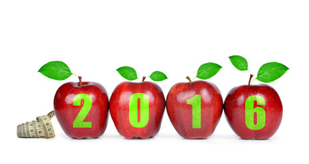 Red apples with measuring tape. Healthy resolutions for the New Year 2016