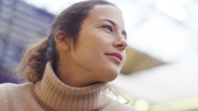  Attractive woman writing in her diary at a train station