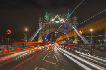 Fototapeta na wymiar Traffic light trails on Tower Bridge in London at night
