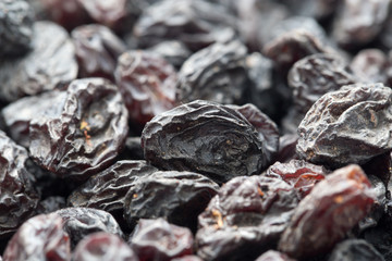 Black raisins as background. macro
