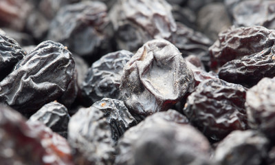 Black raisins as background. macro