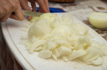 chopped onion with a knife