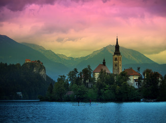 Fototapeta premium Sunset view of Julian Alps, Lake Bled with St. Marys Church of the Assumption on the small island; Bled, Slovenia, Europe