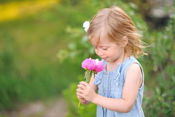 portrait of little girl outdoors in summer