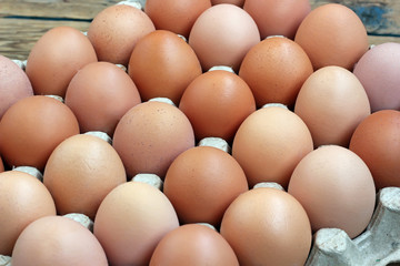 Chicken brown eggs in packing , the top view.