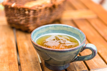 Norman apple cider in a typical ceramic cup