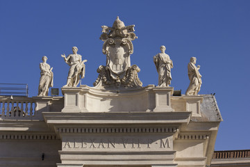 Fototapeta na wymiar Architectural close up of Alexander VII monument on the top of St.Peters Basilica in Rome, Italy