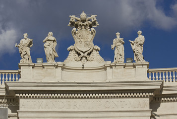 Fototapeta na wymiar Architectural close up of Alexander VII monument on the top of St.Peters Basilica in Rome, Italy