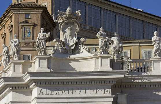 Architectural close up of Alexander VII monument on the top of St.Peters Basilica in Rome, Italy