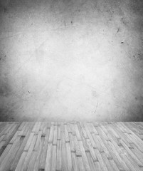 Gray wooden floor boards and grey concrete wall. Copy space