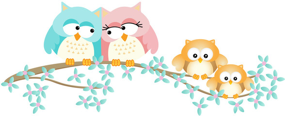 Cute owl family on spring tree branch