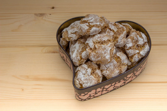 Homemade almond biscuits in tin form of heart