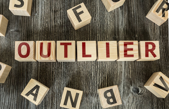 Wooden Blocks With The Text: Outlier