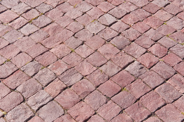 Background texture of red granite paving stone