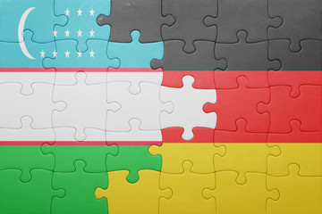 Fototapeta premium puzzle with the national flag of germany and uzbekistan