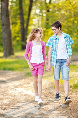 Fototapeta premium Portrait of a boy and girl in summer
