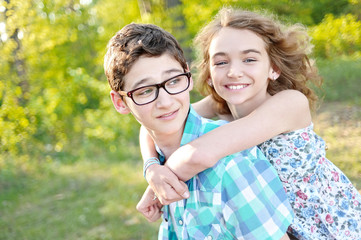 Fototapeta premium Portrait of a boy and girl in summer