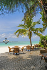 Restaurant on tropical beach next blue ocean