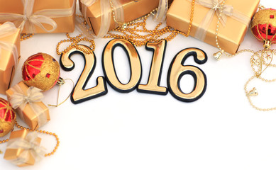 2016 year golden figures on the background of christmas decorati