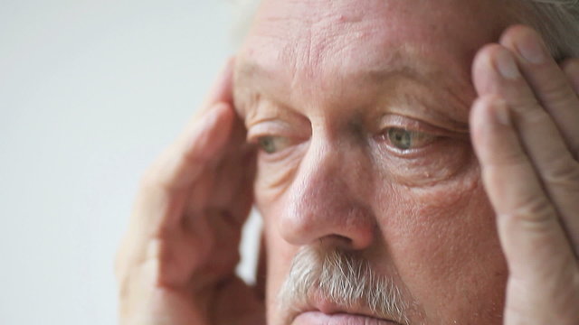 Senior man with bad headache