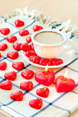 Valentine's day cup of chocolate drink with many heart shaped ca