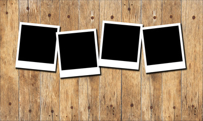 Fototapeta premium Old picture frame on wood background