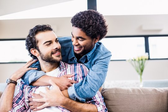 Happy Couple Hugging And Smiling At Each Other