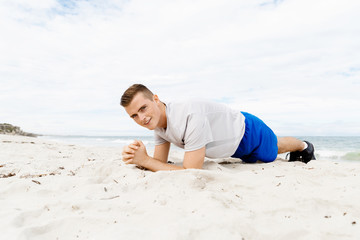 Man training on beach outside