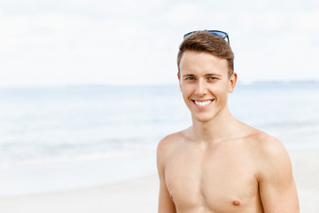 Handsome man posing at beach