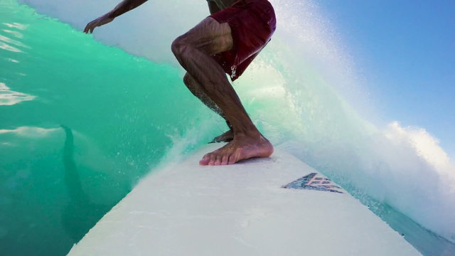 Surfer on Blue Ocean Wave Surfing Getting Barreled. POV GOPRO SELFIE