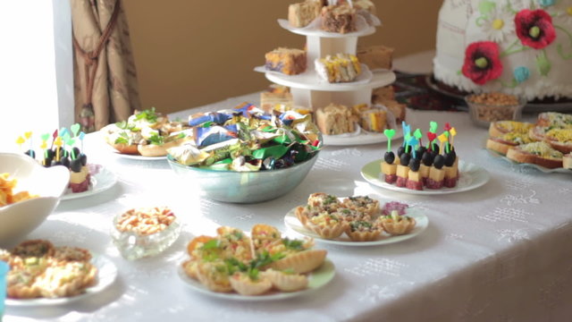 The wedding buffet table with cake