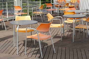 chairs and tables in empty restaurant