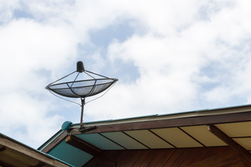 Satellite dish blue sky communication technology network on country home