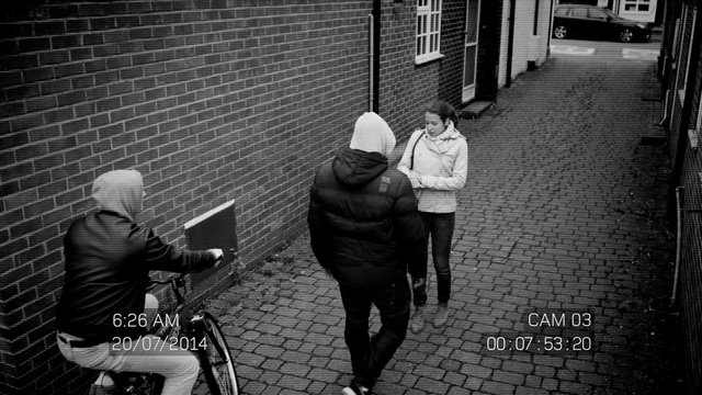  CCTV footage of woman in street being attacked by hooded thugs