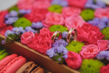 wedding rings in flowers
