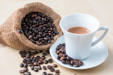 Cup of coffee and fresh roasted organic Coffee beans on isolated background, food and drink background