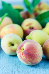 group of fresh peaches on wood background