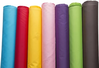 Poster Stof Colorful material fabric rolls  in warehouse