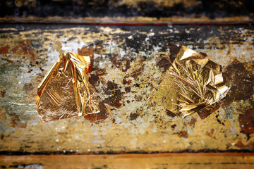 Gold Leaf ,Gold paper texture on Buddha sculpture.