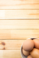hen eggs on wood background