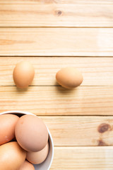 hen eggs on wood background